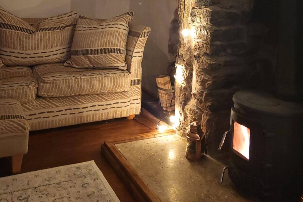 Sofa and fireplace at The Old Telephone Exchange studio